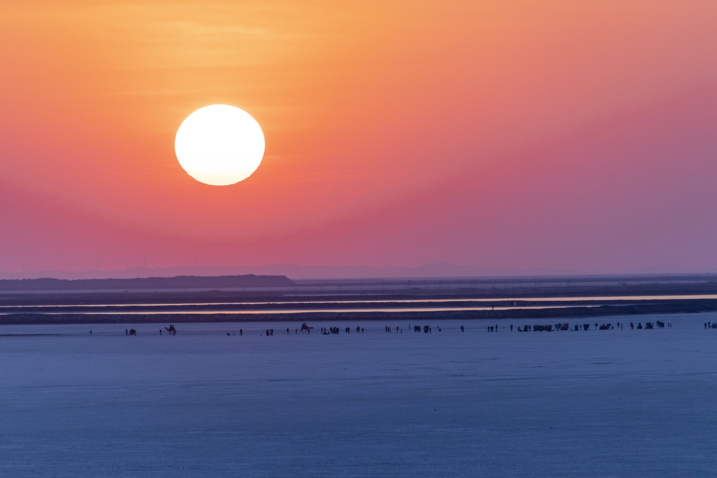 Sunset over the salt marshes of the Rann of Kutch, Gujarat — India with Bernadette