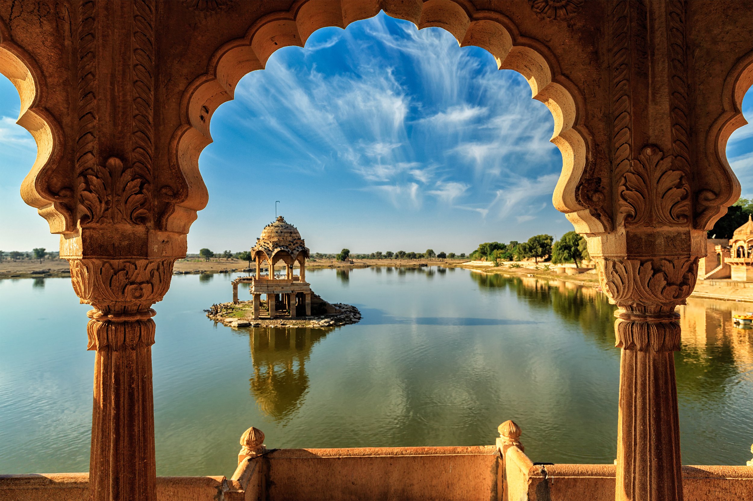 Lake Pichola Udaipur viewed through carved stone arches - Rajasthan textile journey with India with Bernadette
