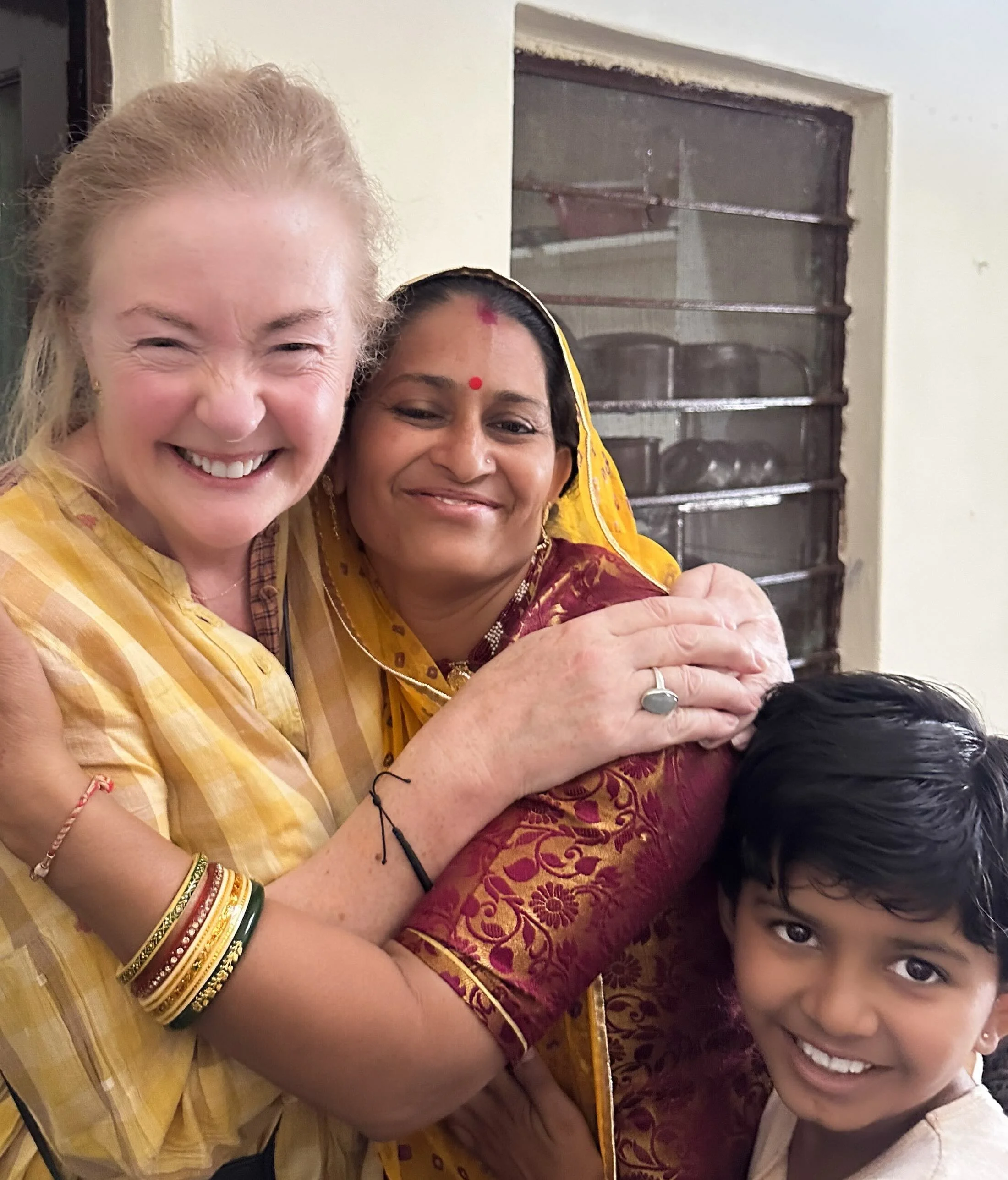 Bernadette O’Farrell embracing a woman at Ruma Devi’s home in Barmer, Rajasthan, during Diwali celebrations, October 2025