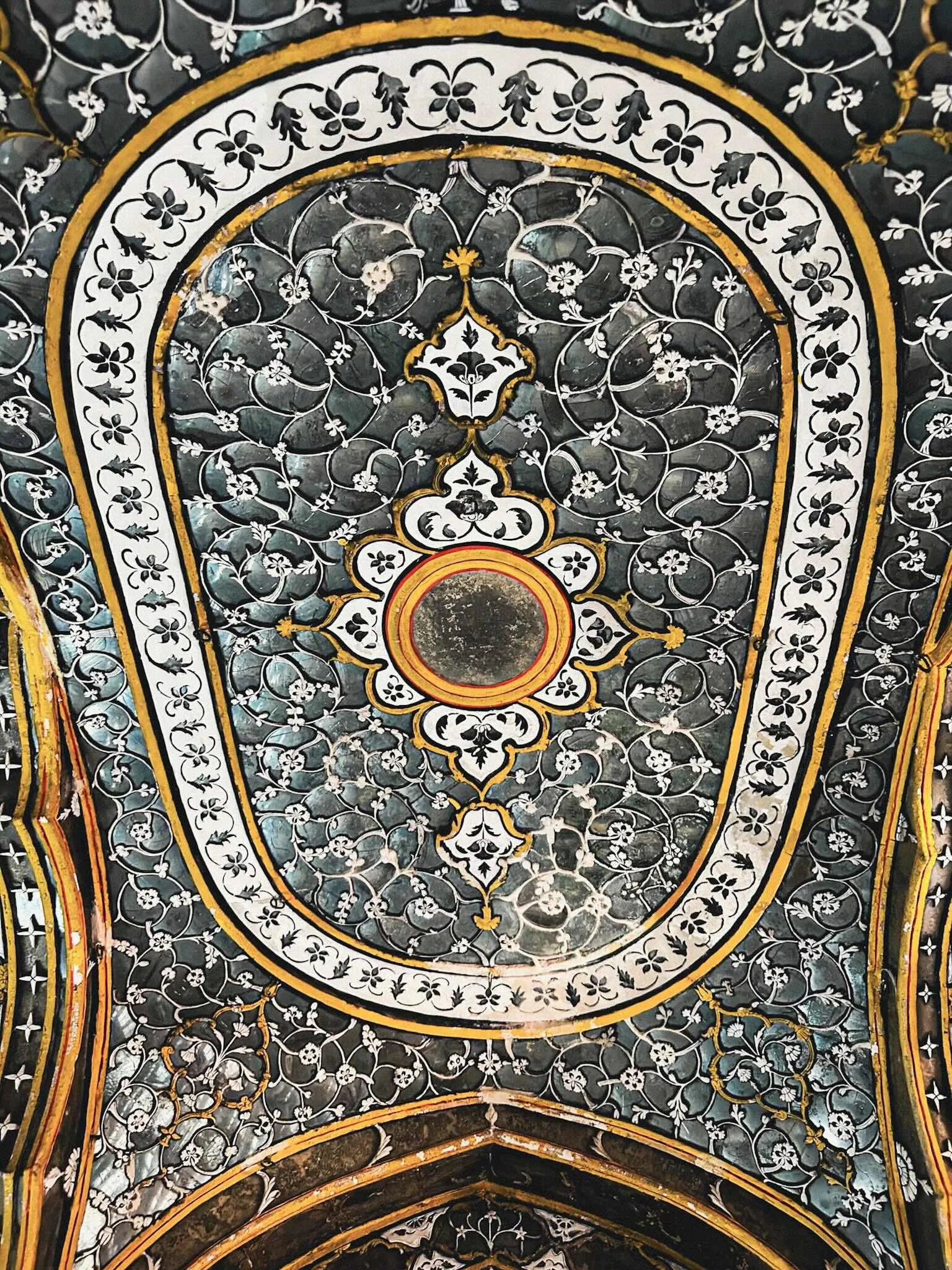 Intricate floral ceiling with mirror work and stone inlay at City Palace, Jaipur, Rajasthan