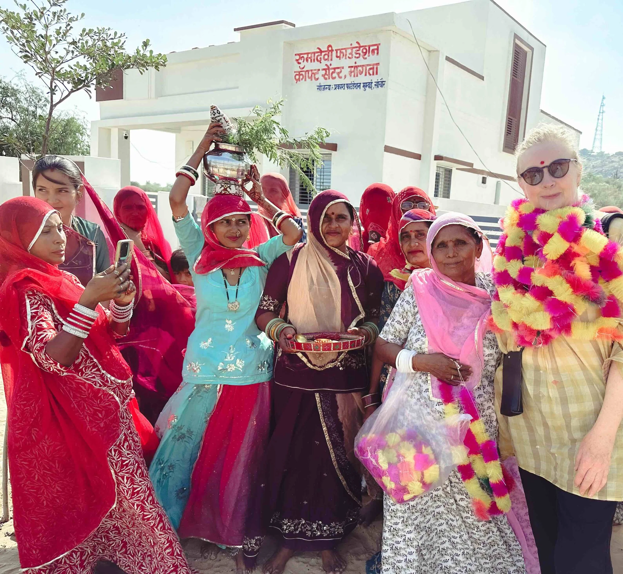 Bernadette O’Farrell being welcomed with garlands outside the Ruma Devi Foundation Craft Centre, Bhangta, Barmer district, Rajasthan, October 2025