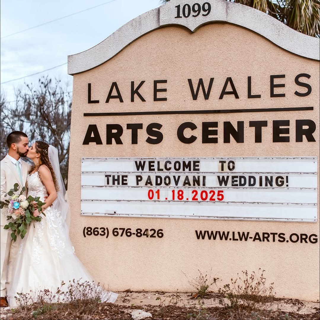 Sign for Lake Wales Arts Center celebrating a wedding on January 18, 2025, with a photo of a bride and groom sharing a kiss.