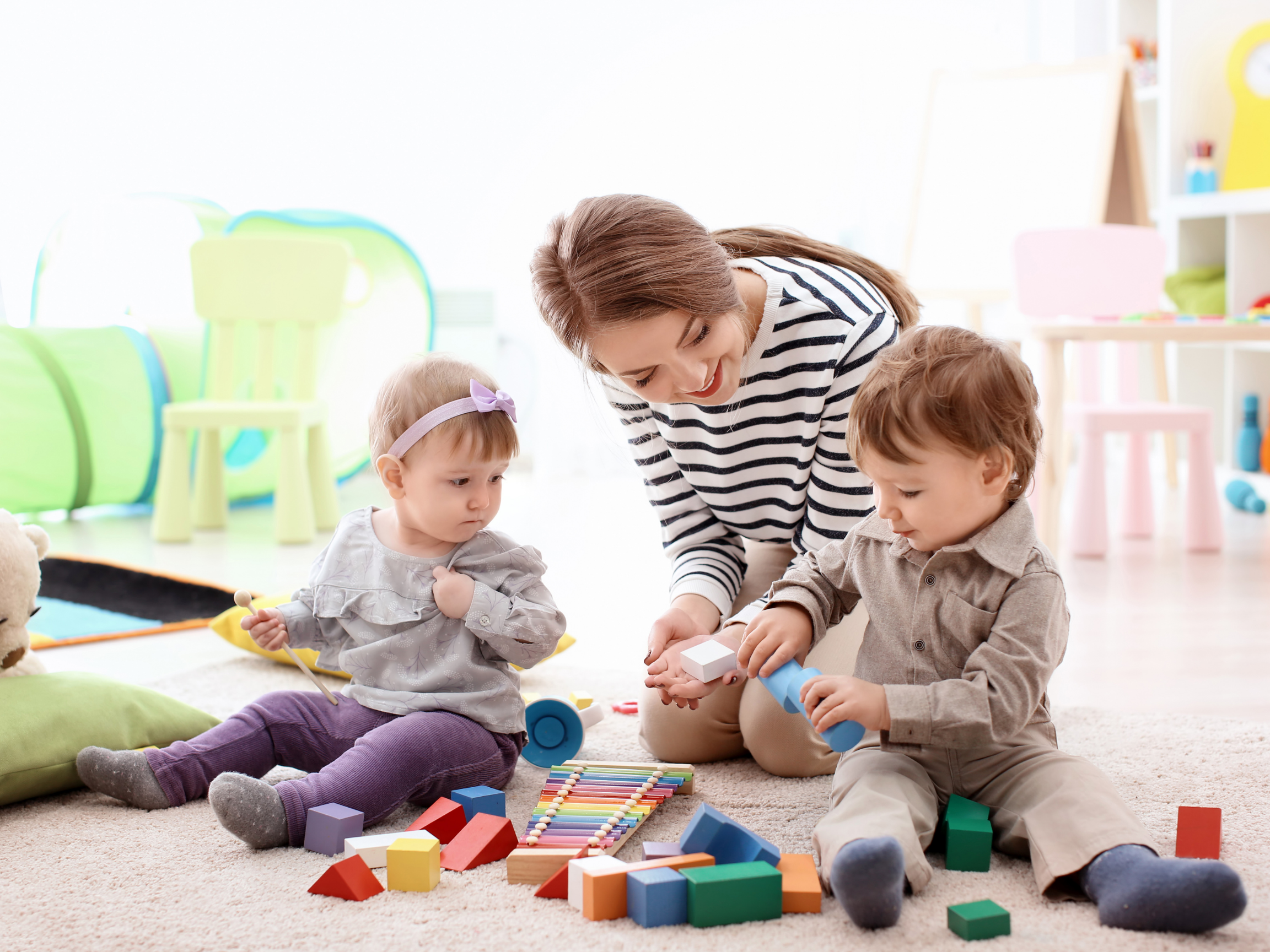 Laurie’s customers, Mariana and Carmen holding hands on a green lawn on their wedding day.