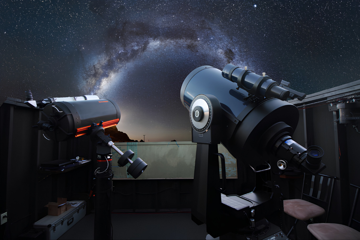 Telescopes at Spencer's Observatory pointing towards the starry night skies