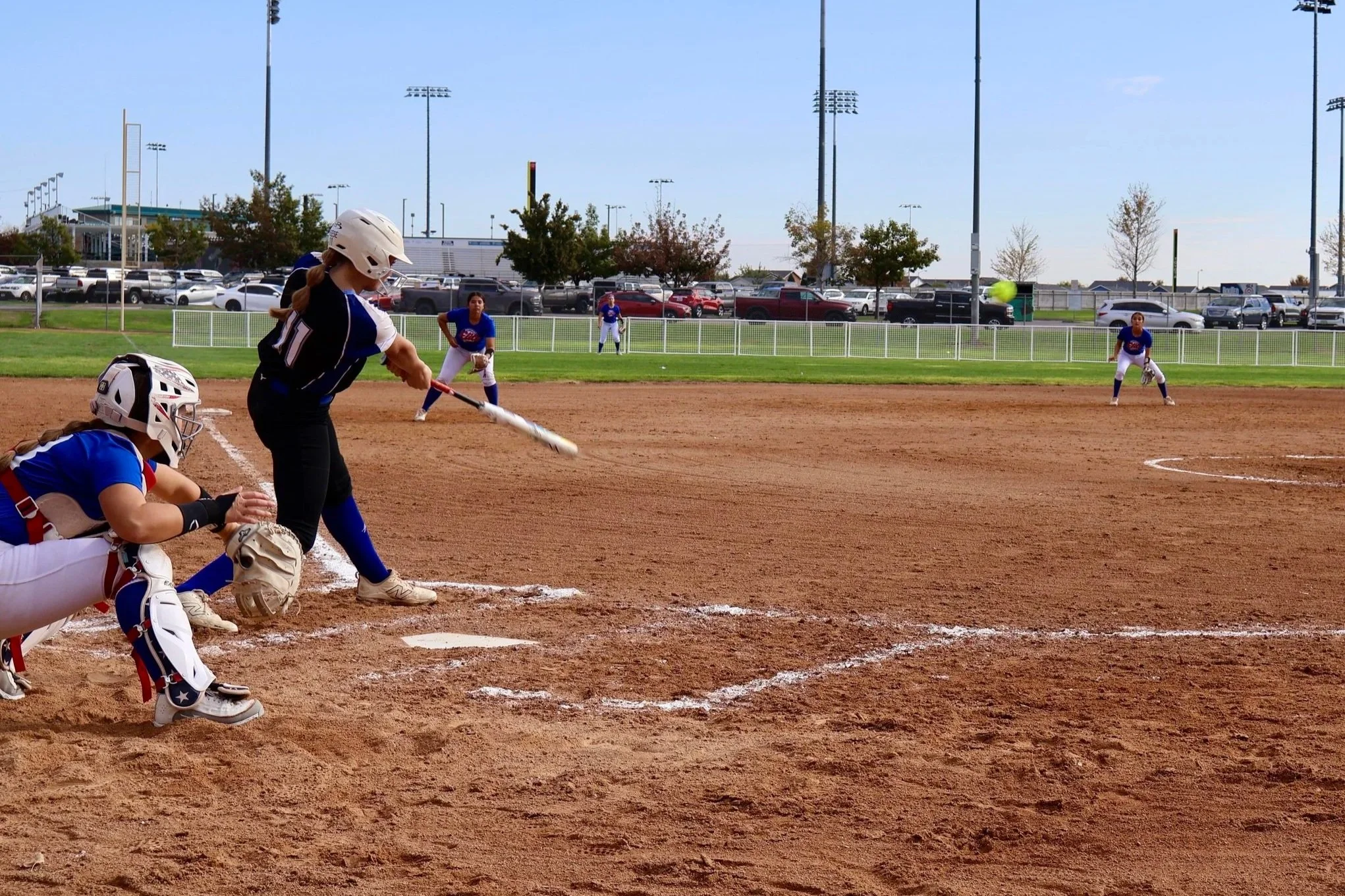 Springer Fastpitch - Catcher and batter competing at softball travel tournament