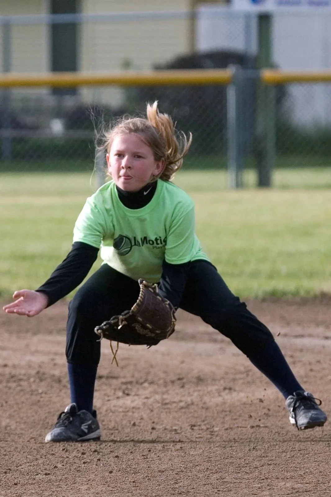 Springer Fastpitch - Softball player fielding on defense
