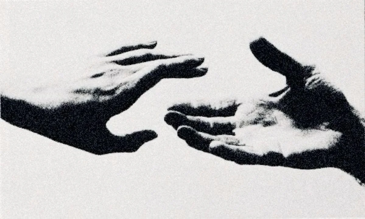Silhouettes of two hands reaching toward each other against a white background.