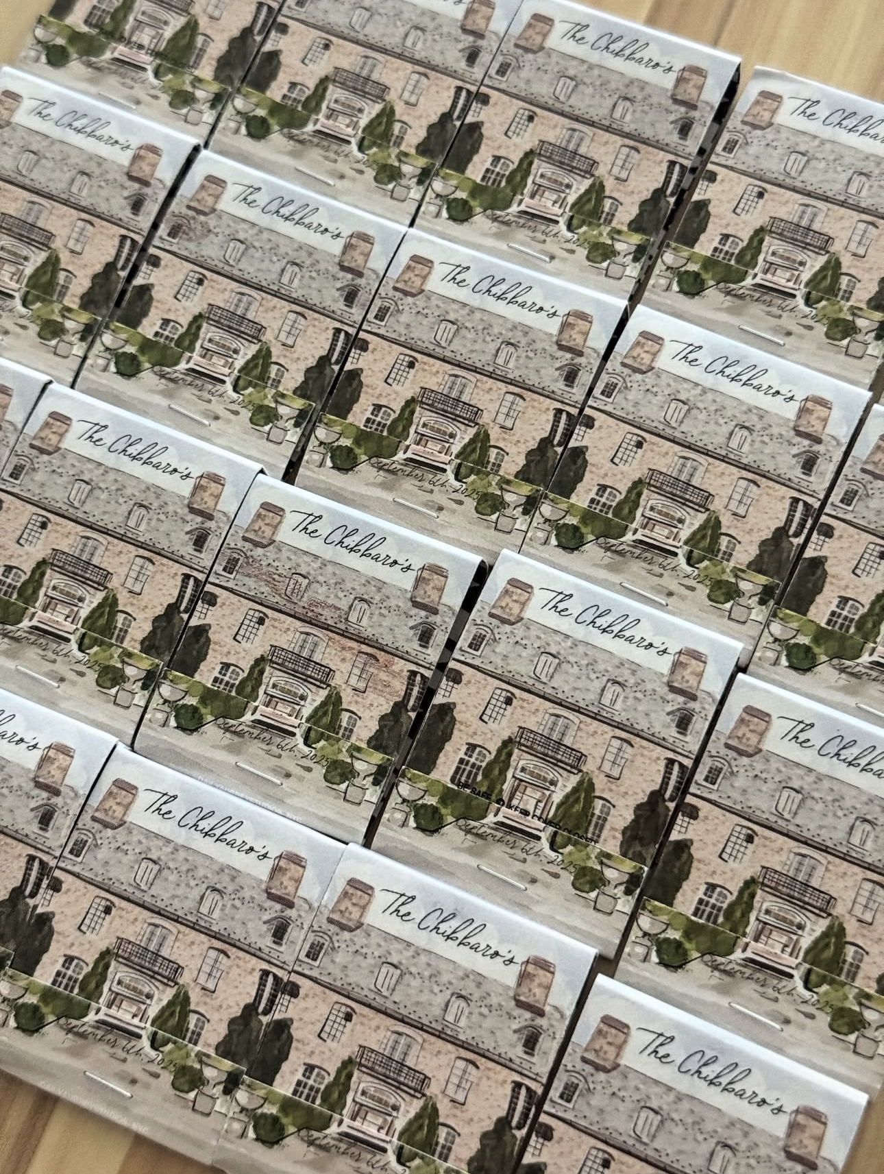 Multiple boxes featuring artwork of a building with trees, labeled 'The Chiliparo's.'