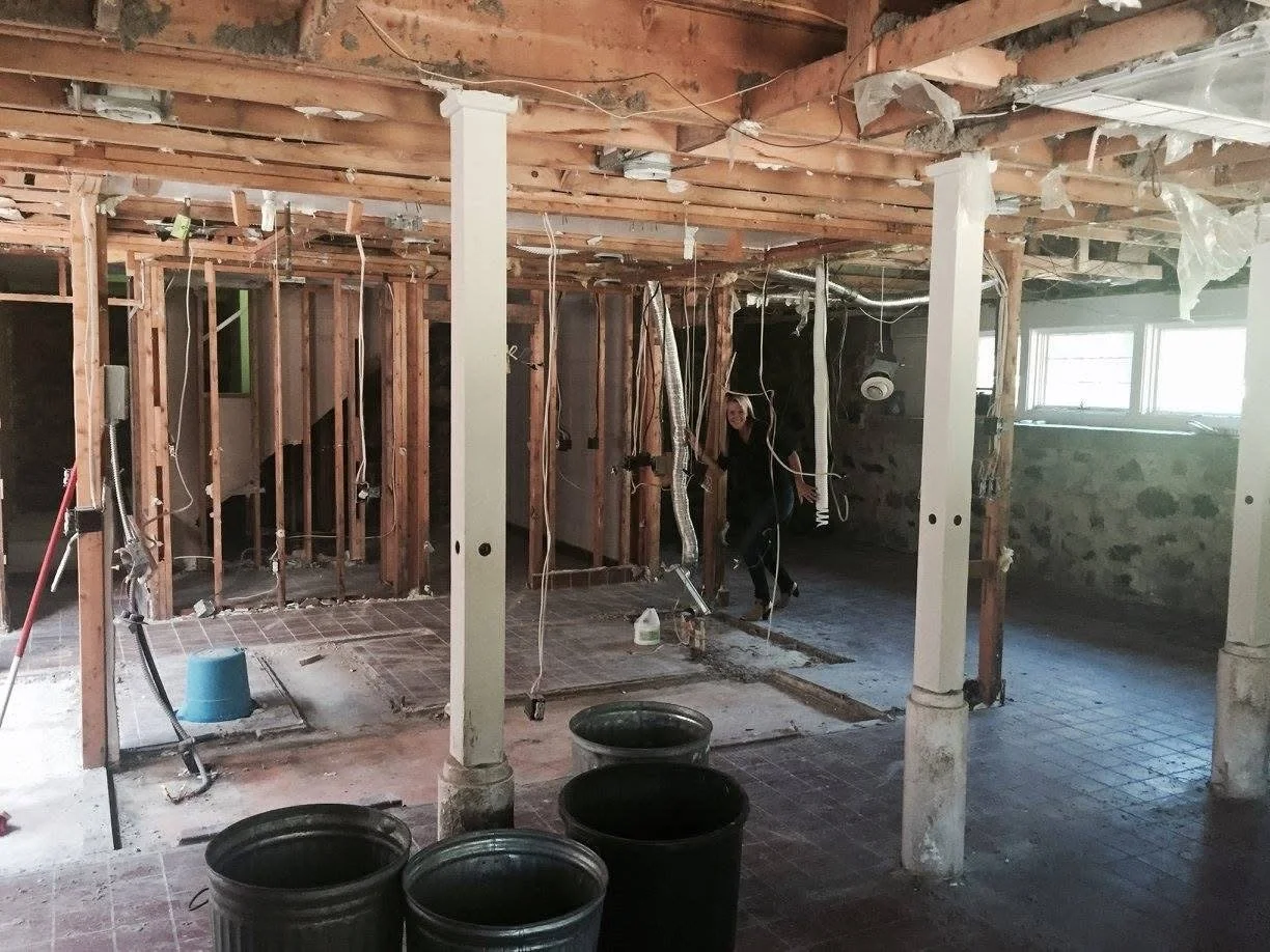 Transformation: Part of the process, showcasing preserved beautiful fieldstone walls integrated into the design. 