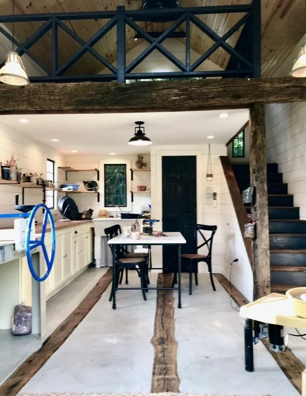After: MichaelAngela Properties transformed it into a bright design studio - cleaned, cleared, salvaged with a second-story loft, now a creative haven. 