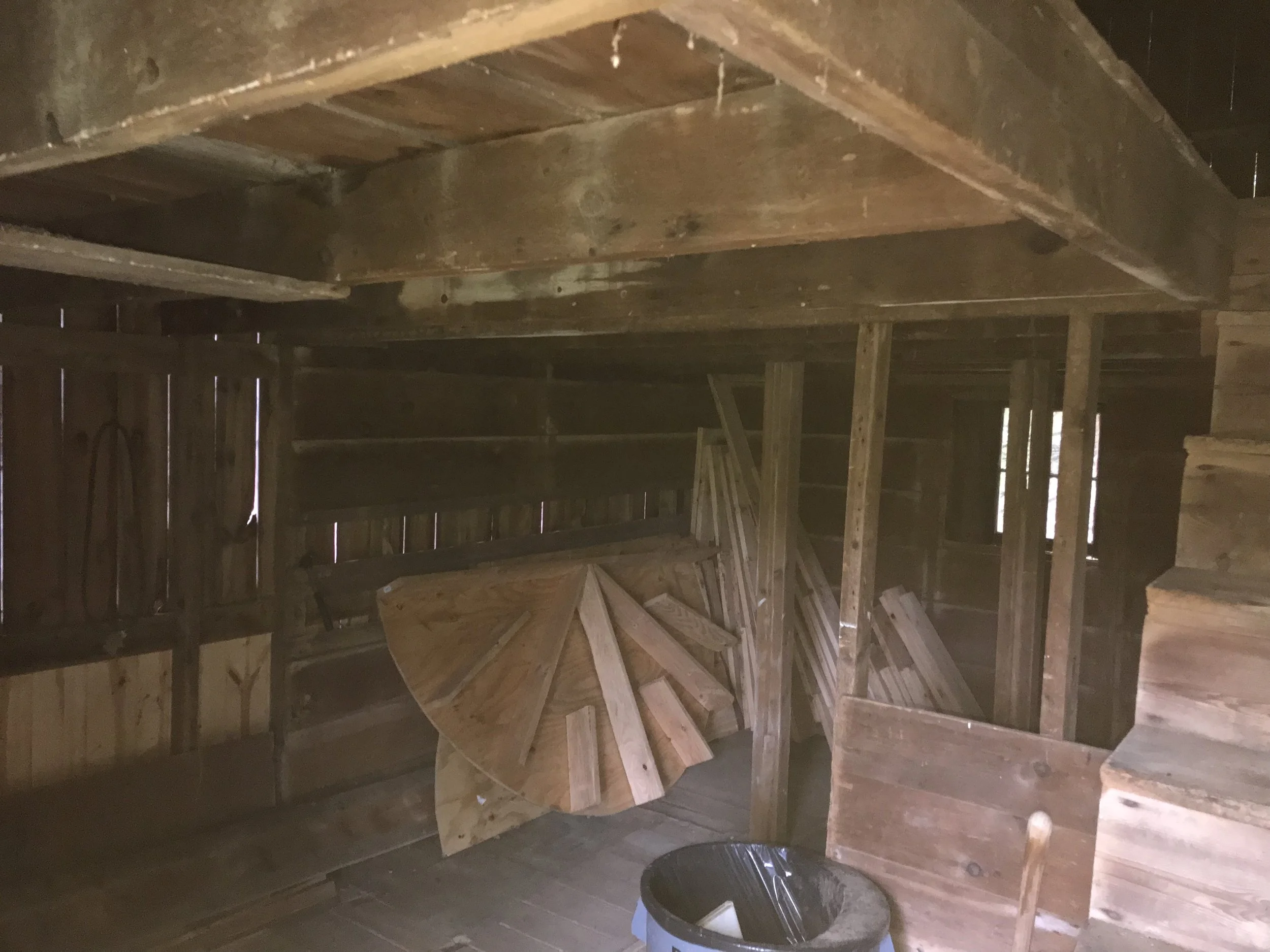 Before: Dingy 1880's barn interior, once home to livestock, dirty and cluttered with no hope. 