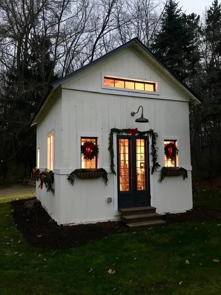 After: MichaelAngela Properties revived it into a design studio - infused with estate windows from a New York estate, creating a stunning, functional space with historic charm. 