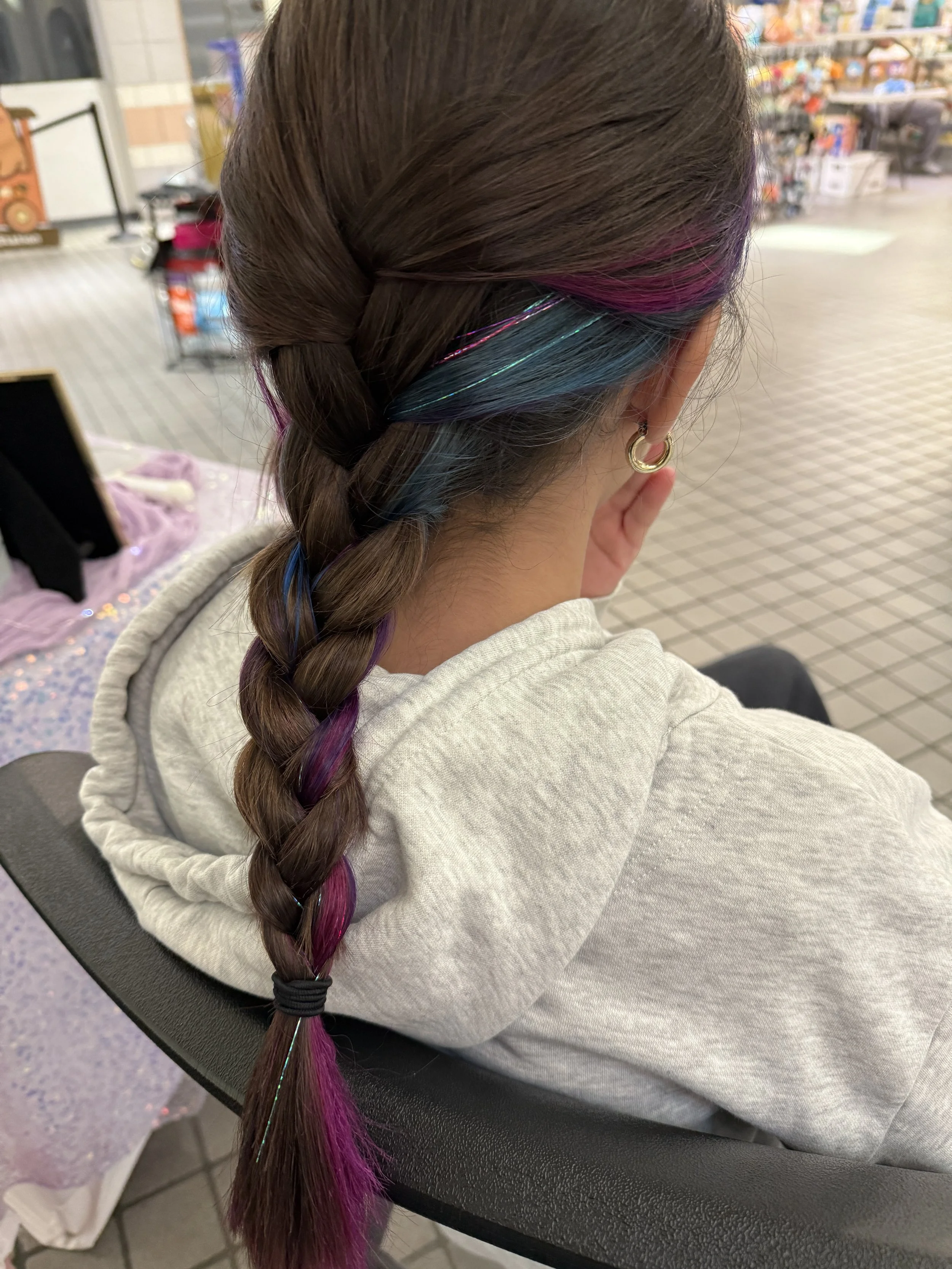 Rainbow hair tinsel in colorful hair