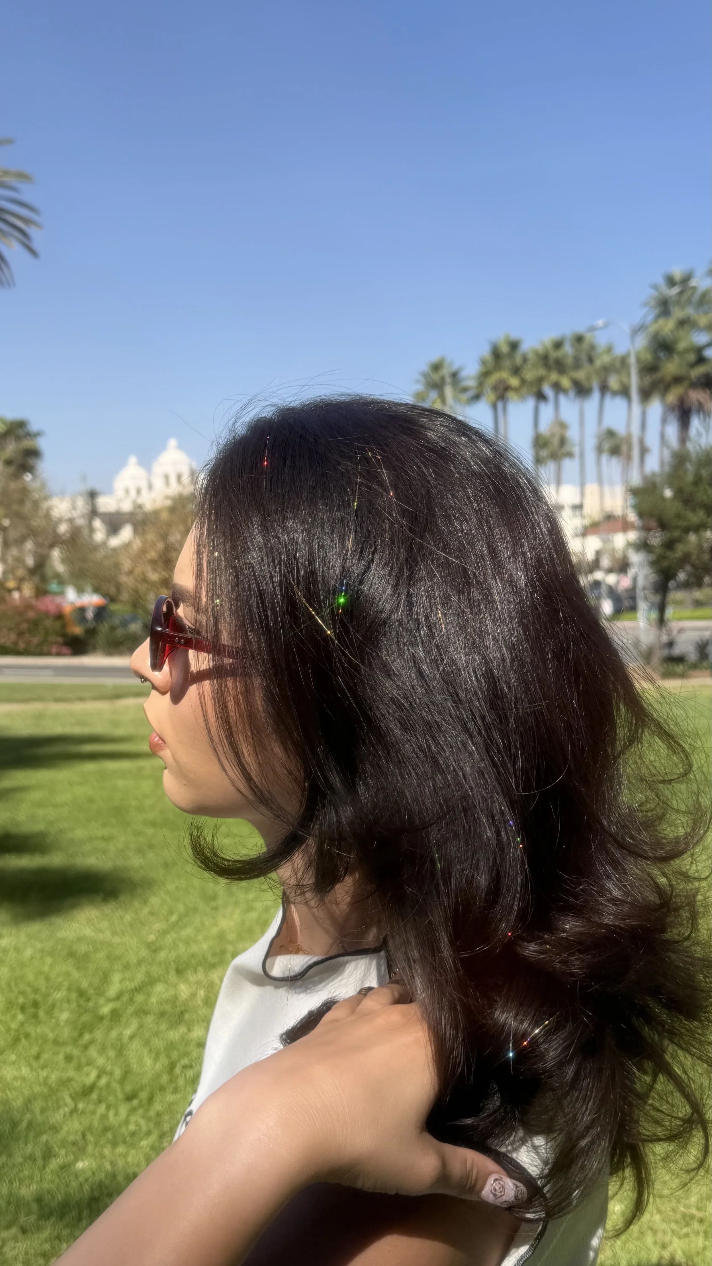 gold hair tinsel in dark brown hair