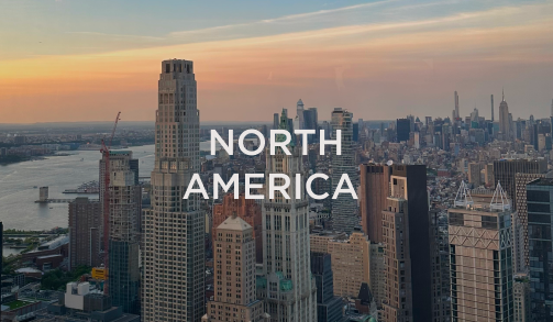 Aerial view of the New York City skyline at sunset with “North America” text overlay, representing the hospitality markets served by DC Global Talent recruitment specialists.