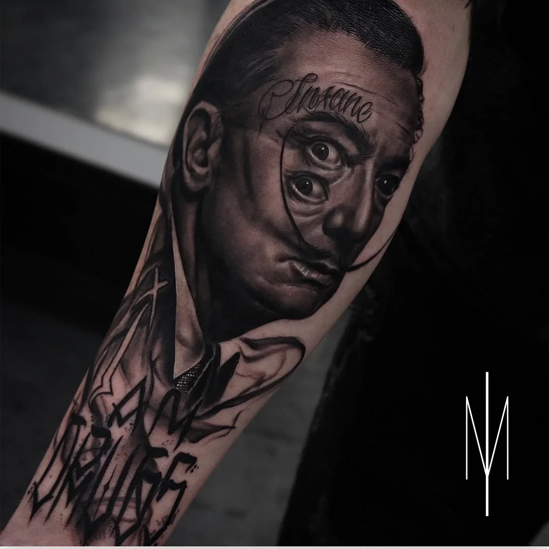 A realistic black and gray tattoo of a man's face with four eyes, with the word 'insane' written above the face.