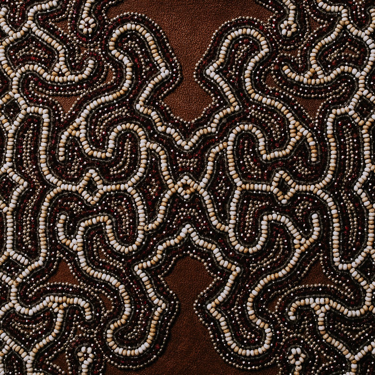 Intricate beading by Laura. Every bead is backstitched for more protection with wear. Gemstones of ancient beads, tourmaline, and pyrite showcased here.