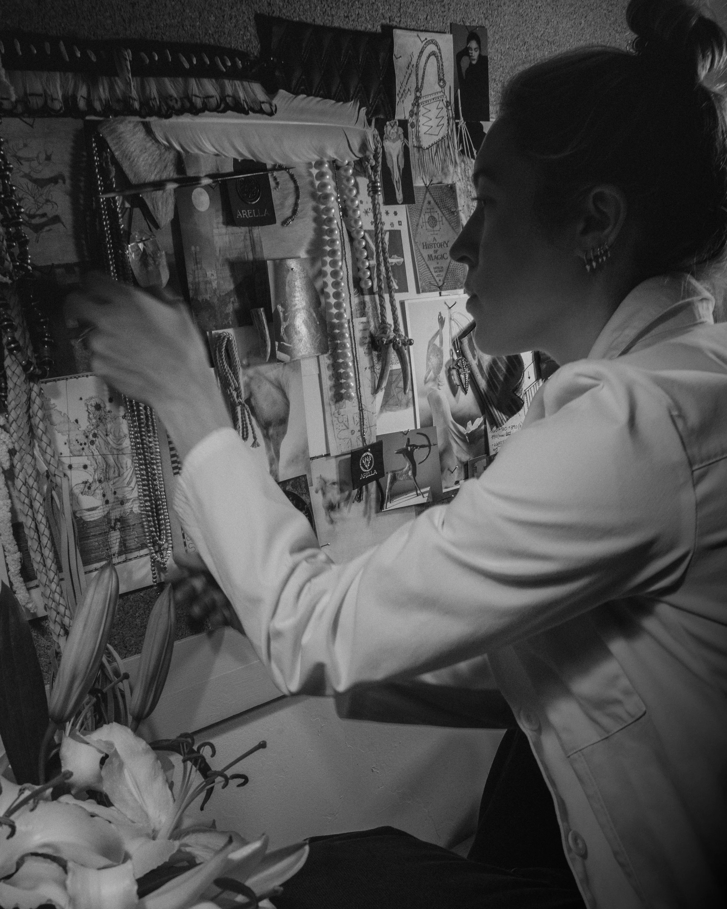 A peak inside the studio where Laura, the maker, is working on a vision board for her capsule, "Ode to the Mystics."