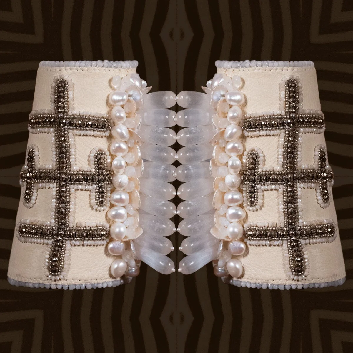 Astrae : a work of art.Part of our warrior cuffs, Astrae has been made with the most beautiful moonstone, selenite, palomino deer, pearls, and pyrite.