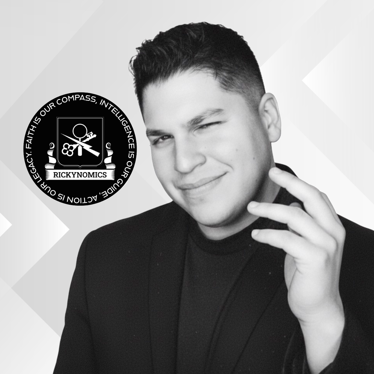 Black and white portrait of a smiling young man with short hair, wearing a dark blazer, winking, with a hand near his face, alongside a circular badge with text and symbols.