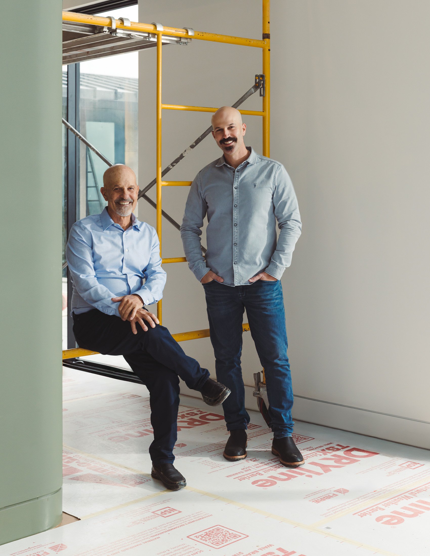 Norman and Nathan of Norman Charles Construction on site in residential build