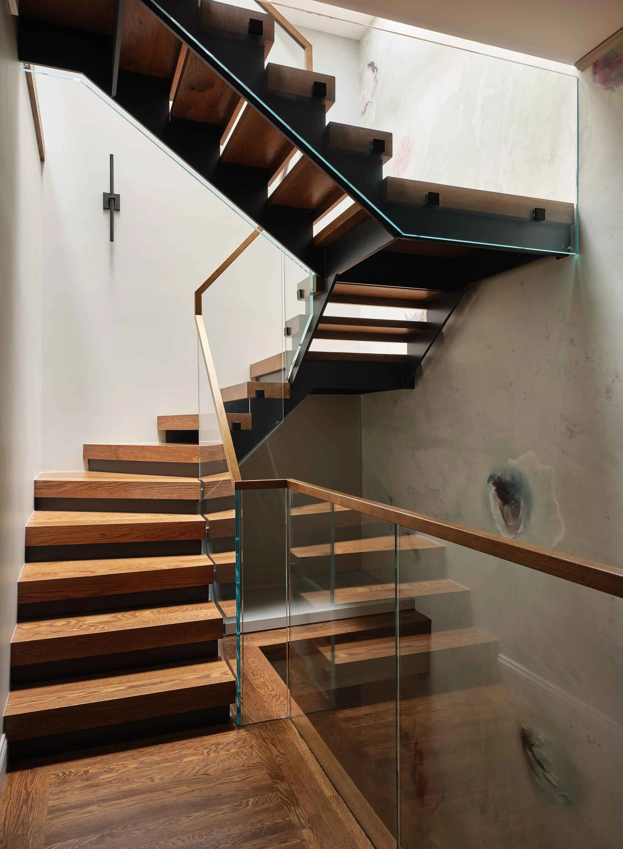 ncc-victorian-renovation-floating-staircase-oak-treads-glass-railing-steel-stringer.jpg