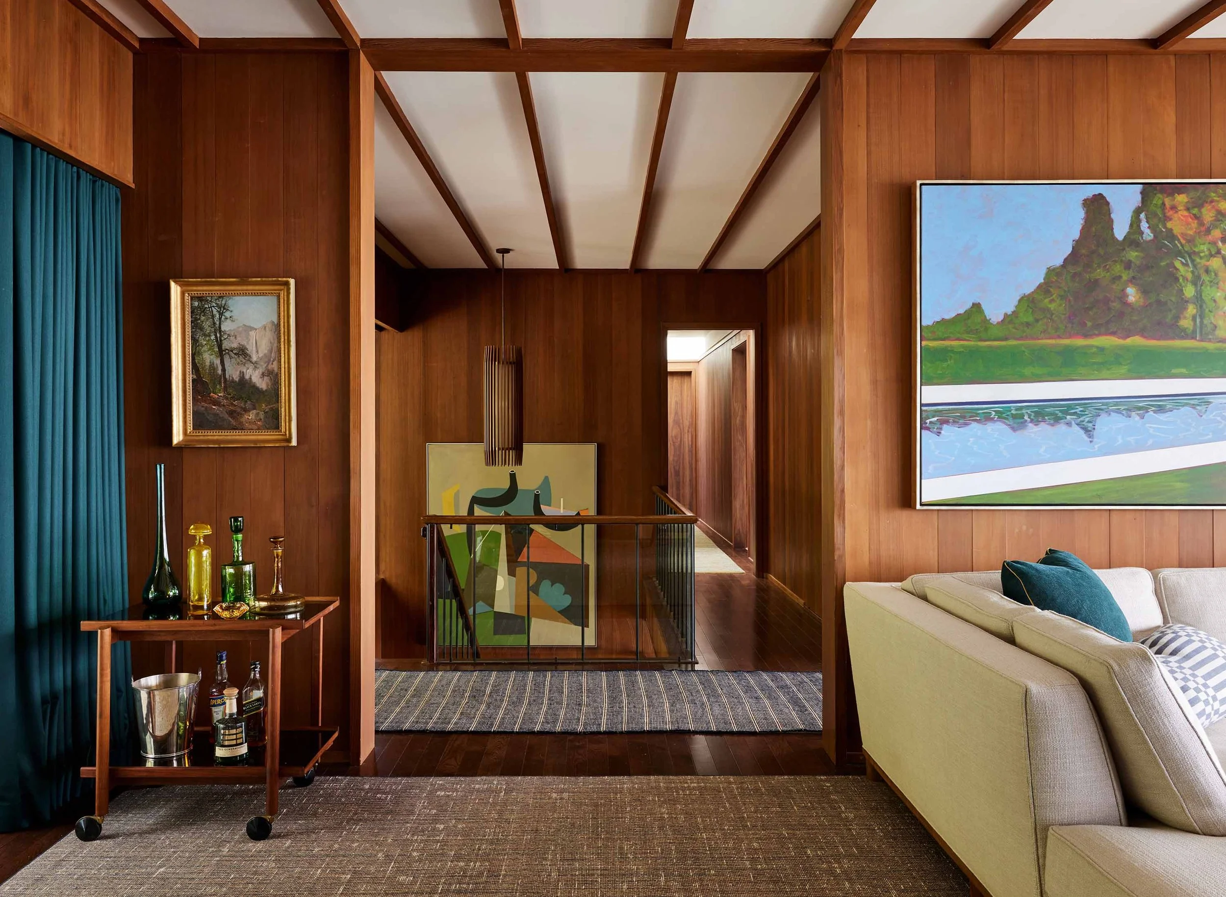 Mid-century interior renovation with wood paneling and artwork in Sausalito residence