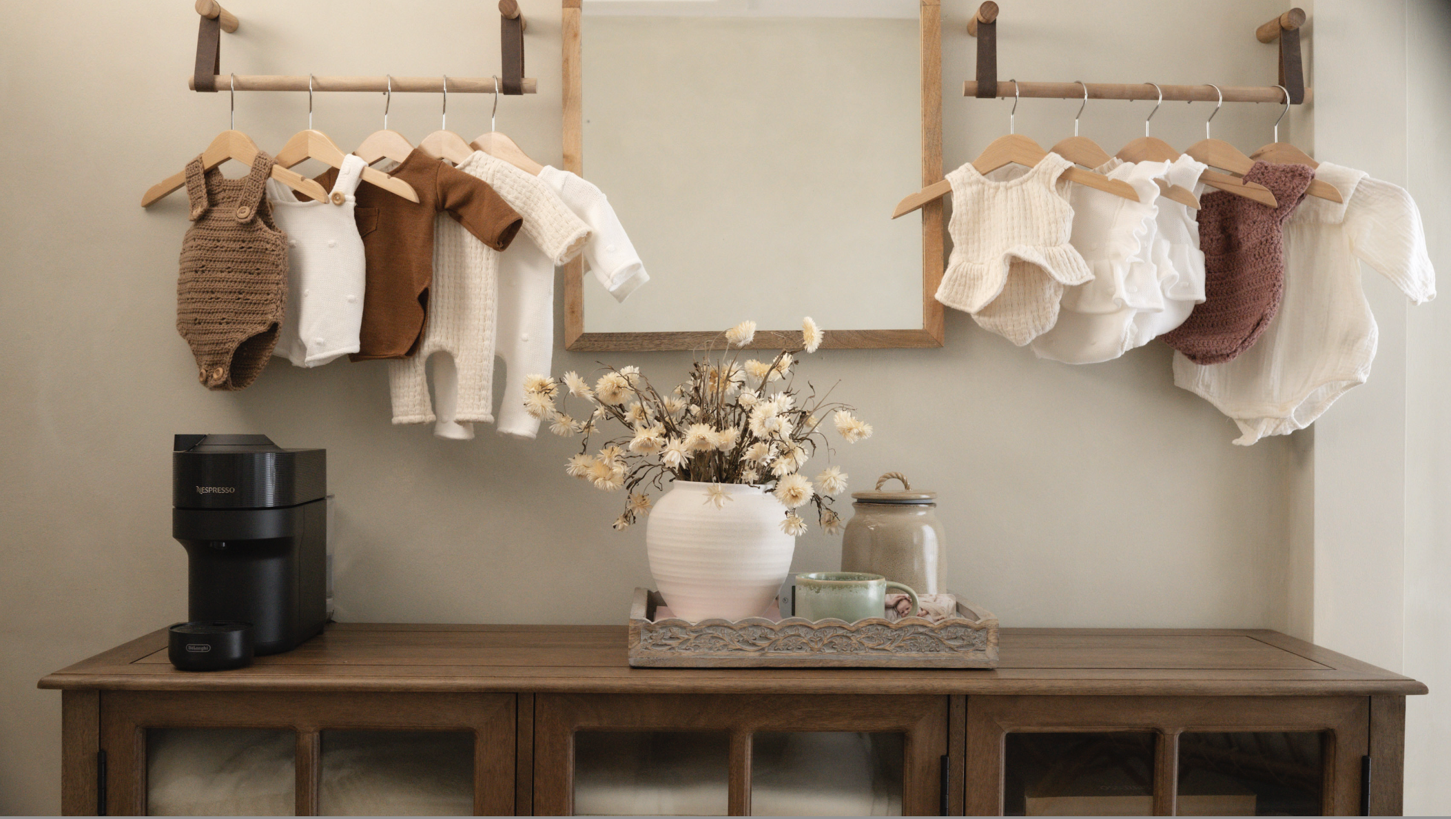 Coffee station with newborn wraps, neutral baby clothing and styling inside Little River Photography's calm countryside studio.