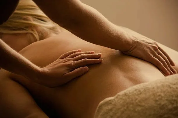 Person receiving a back massage.