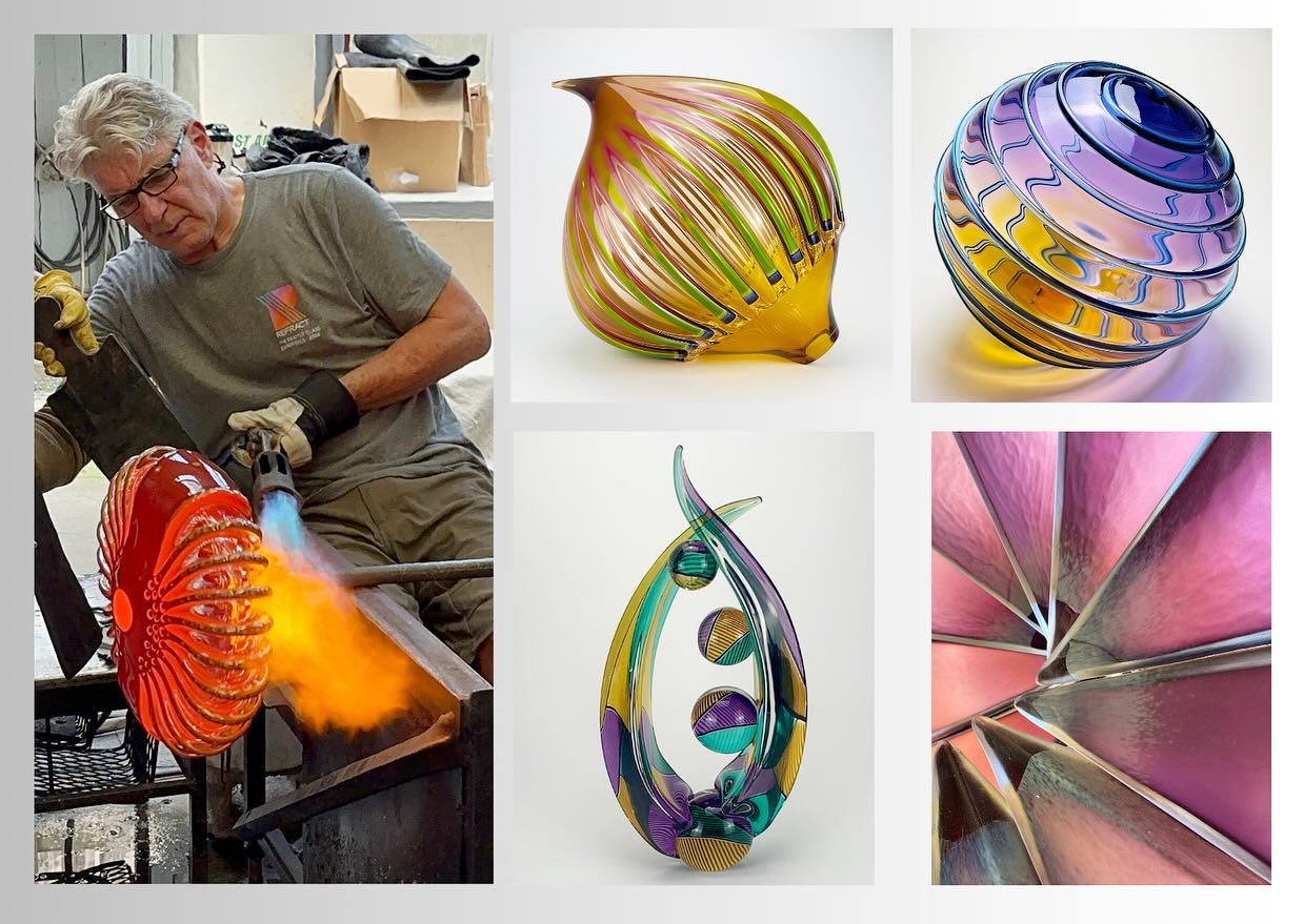 A glass artist working with a torch on a colorful glass piece, surrounded by several finished abstract glass sculptures with vibrant, swirling patterns and shapes.