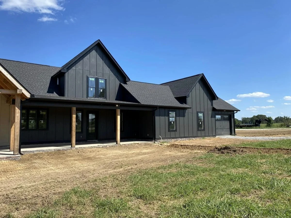 New black modern farmhouse with black seamless gutters