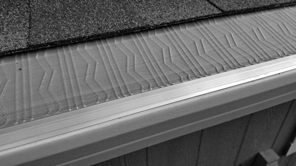 Premium stainless micro-mesh gutter guard installed on a gutter