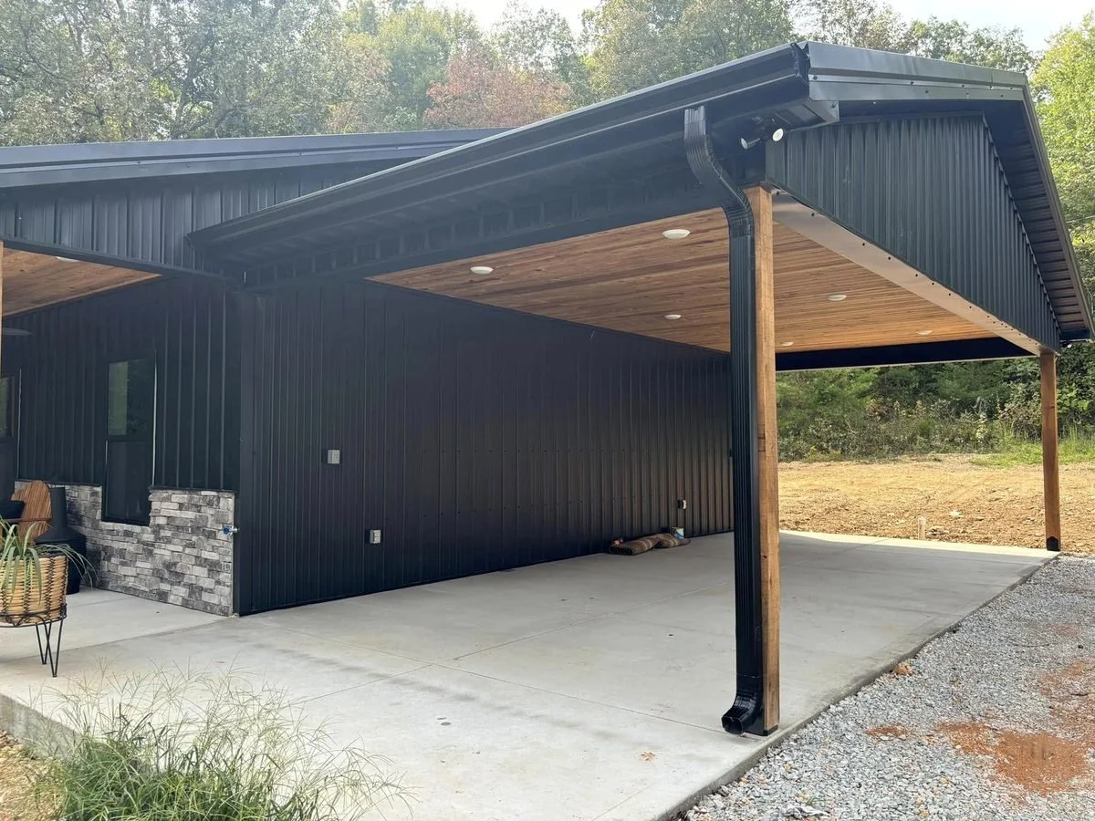 Black carport with matching seamless gutters and downspout