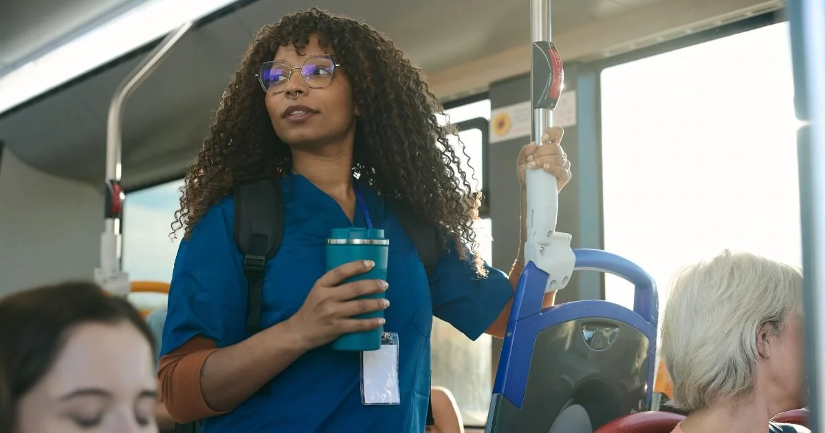 Alt text: Person commuting on public transit, highlighting the impact of long commutes on vein health.