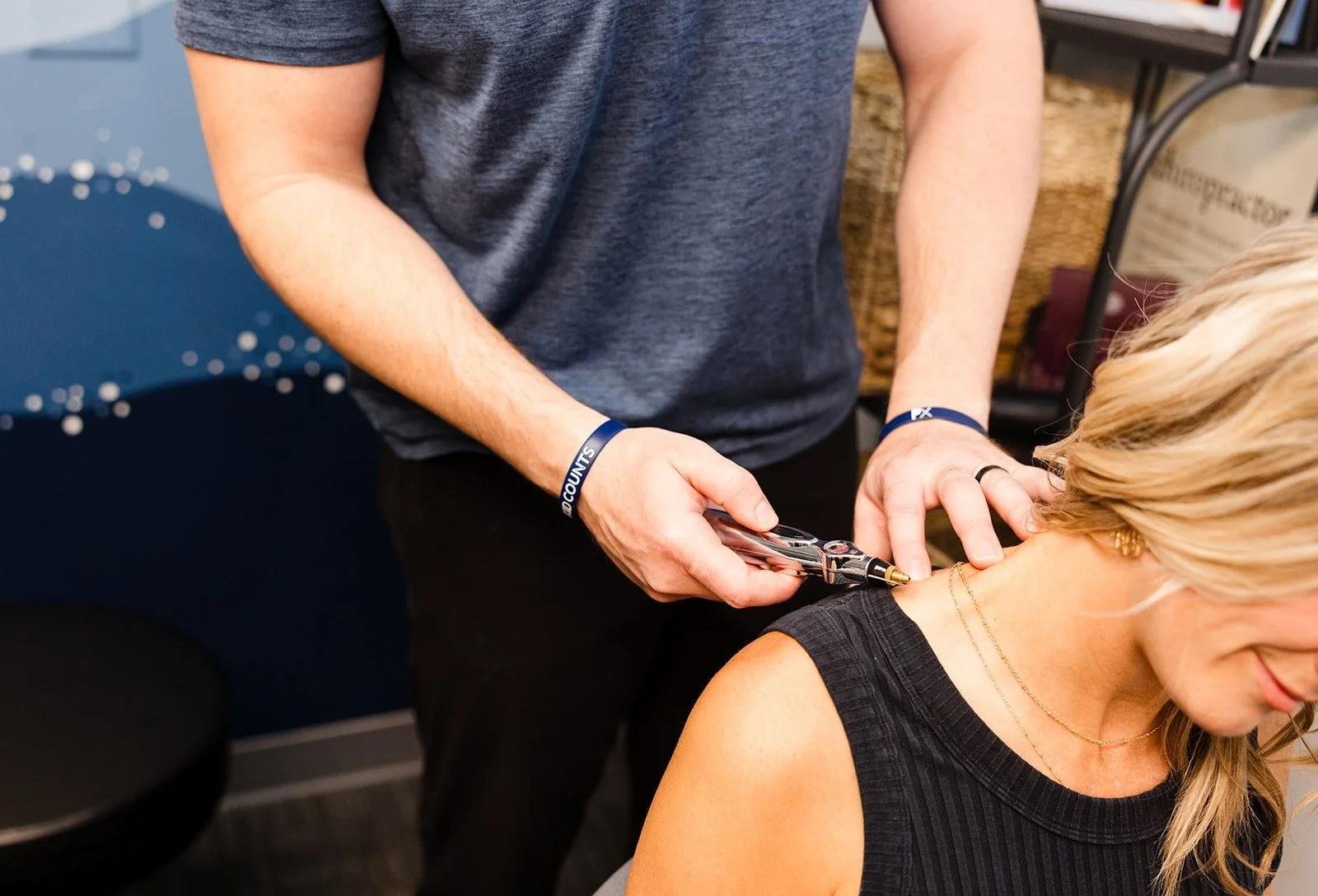 Cervical neck adjustment on female patient showing adult chiropractic approach
