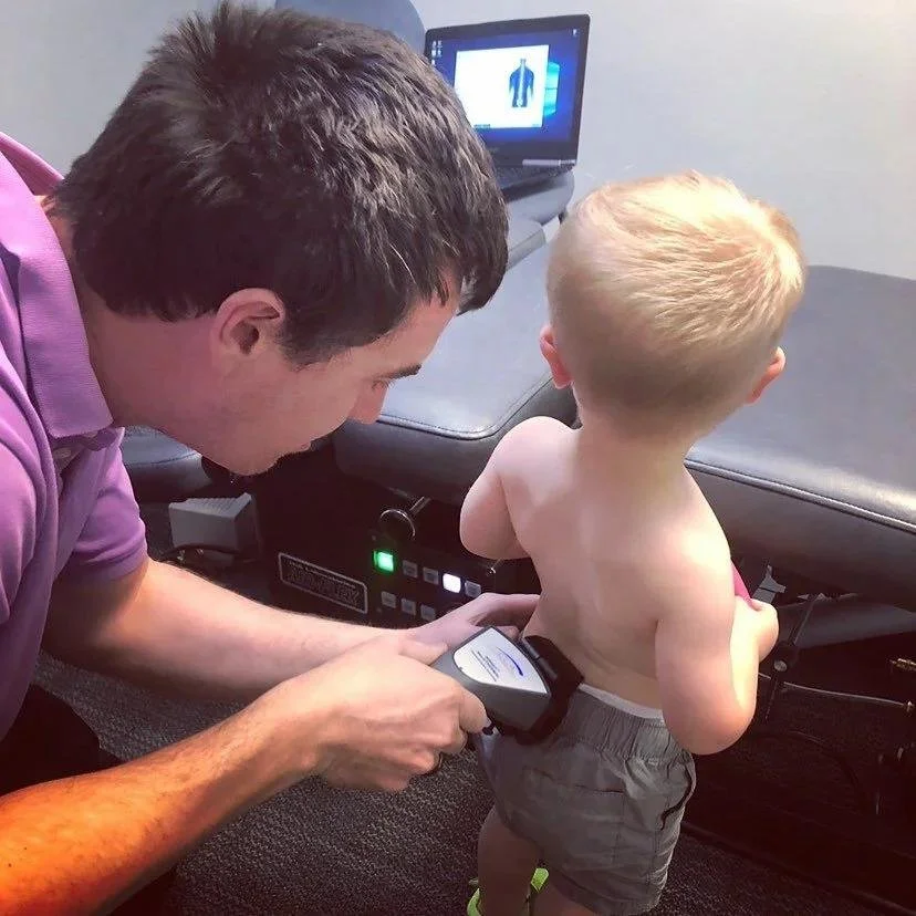 Boy looking at CLA INSiGHT scan screen during ADHD neurological assessment in Liberty MO