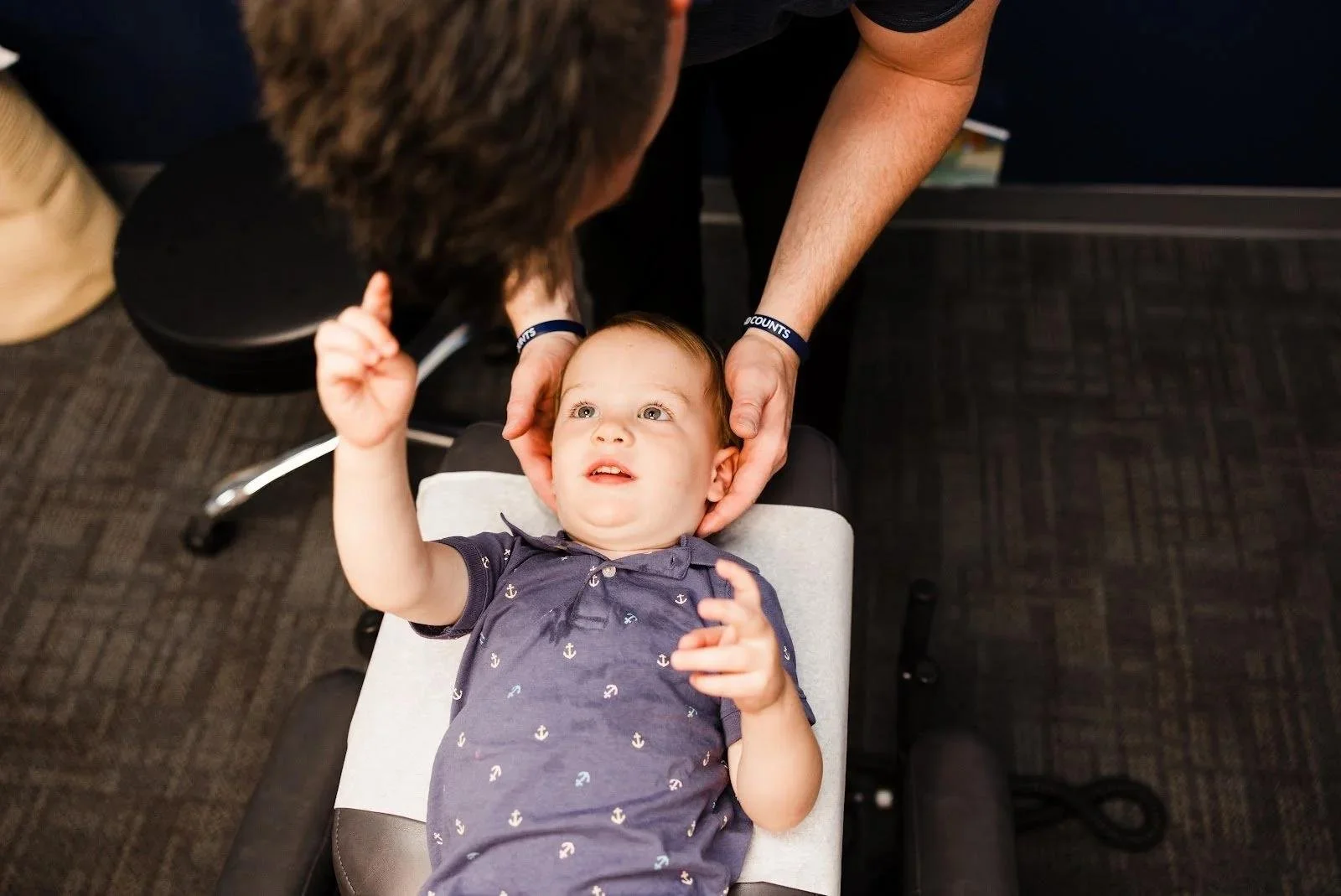 Baby on examination table during infant reflux assessment in Liberty MO
