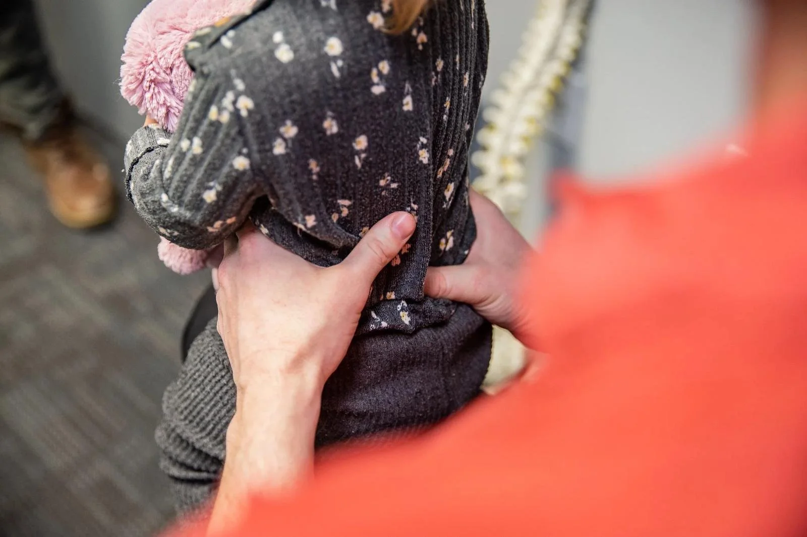 Gentle infant chiropractic adjustment with fingertip pressure