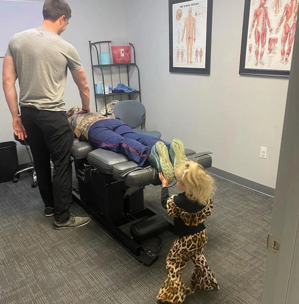 Female patient receiving chiropractic adjustment during concussion recovery treatment