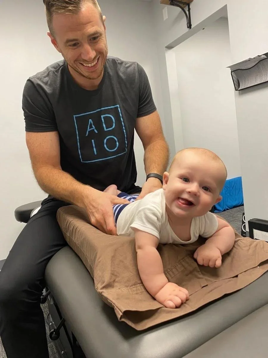 Happy smiling baby after infant chiropractic visit