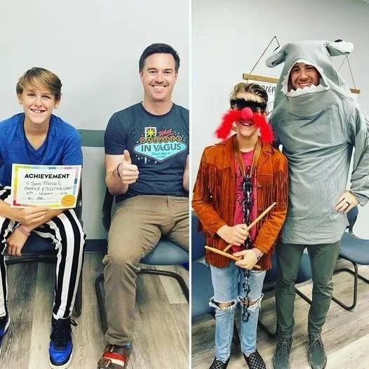 Kids and staff in costumes at community sports event