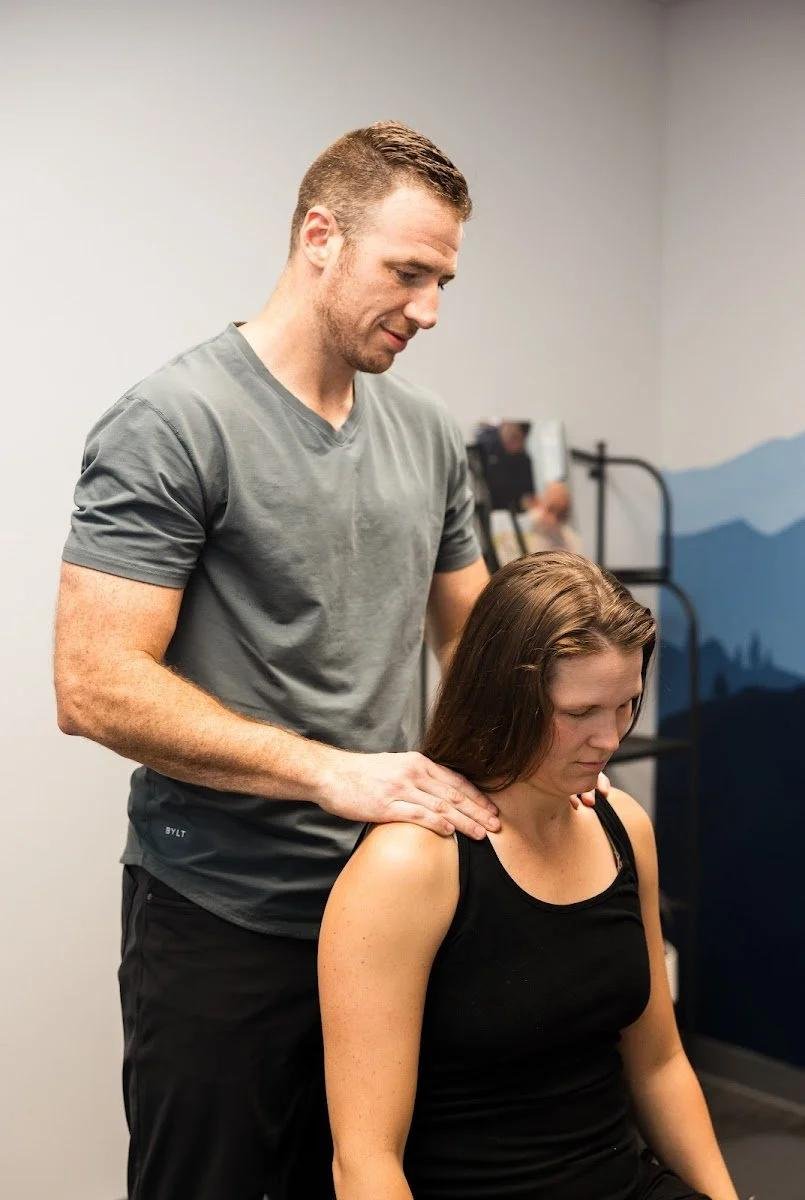 Adult male patient receiving spinal adjustment for chiropractic care