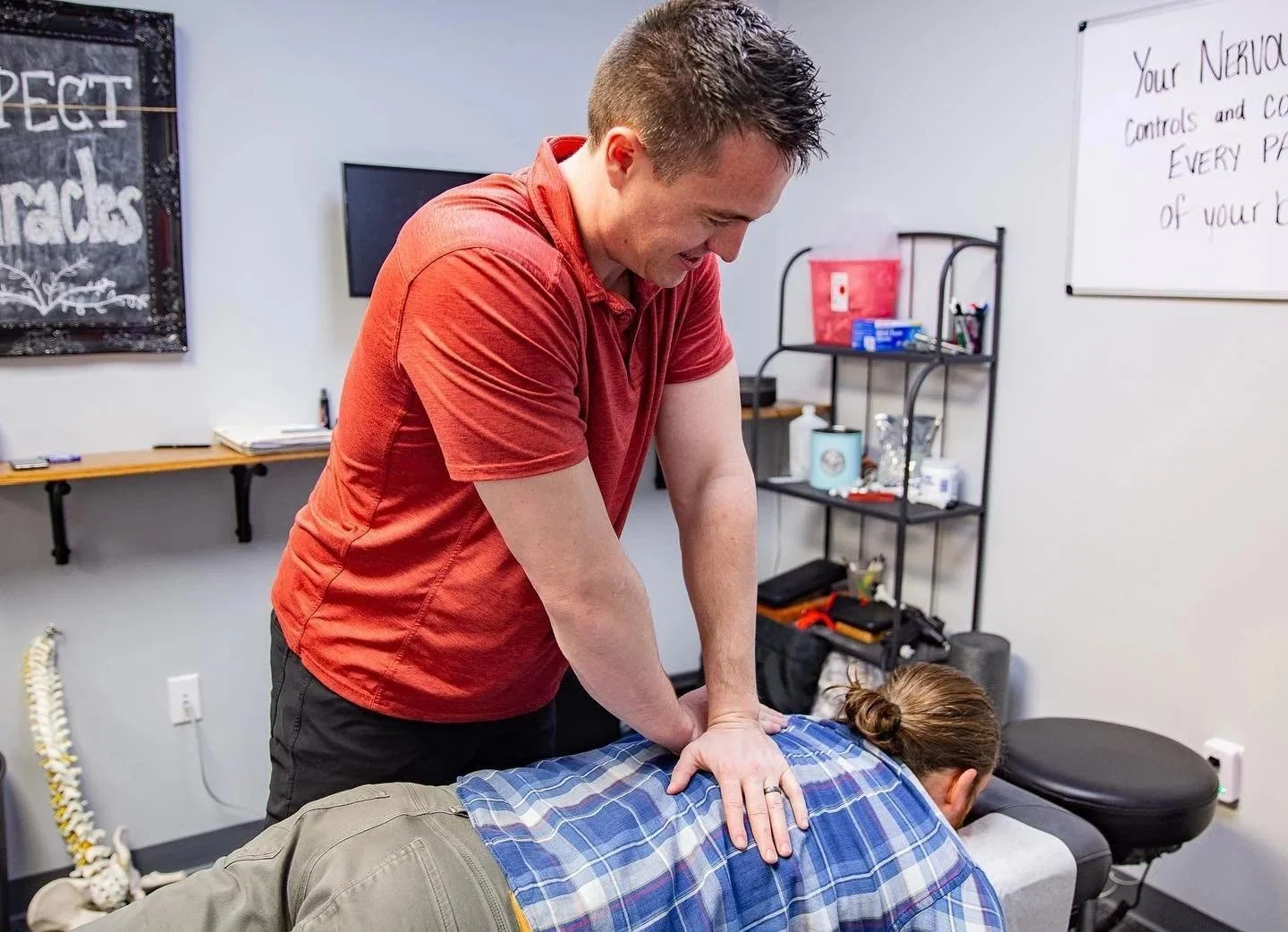 Dr Garrett Smith performing back adjustment for back pain care