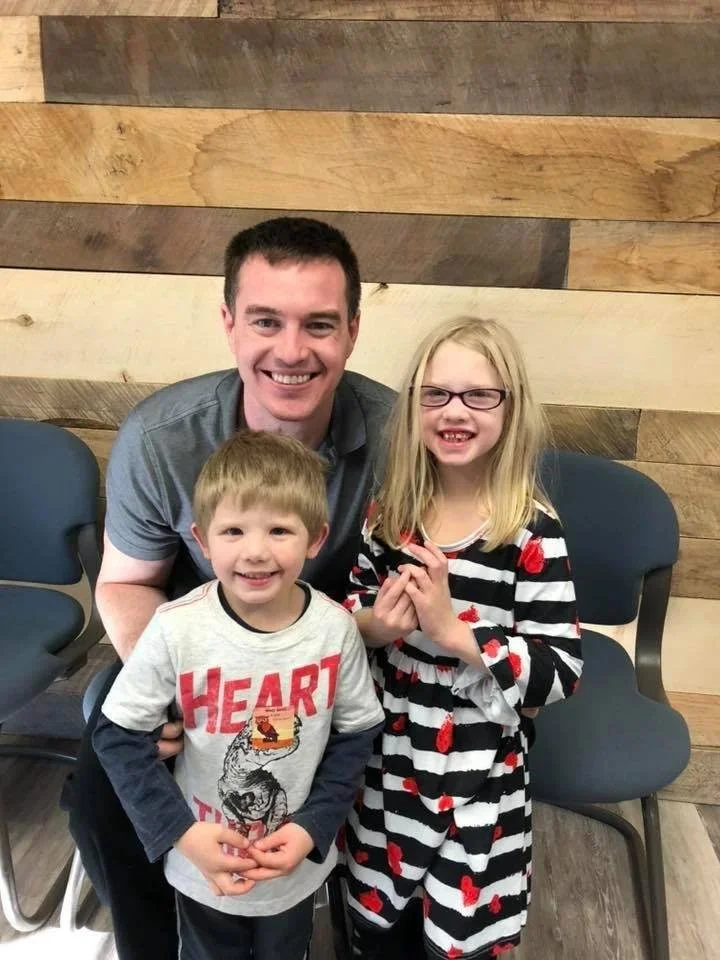 Dr and kids smiling representing Kearney families