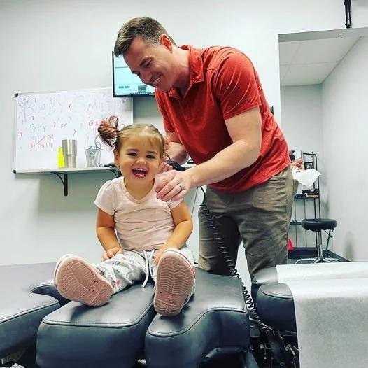 Toddler on adjustment table receiving gentle care for North Kansas City families