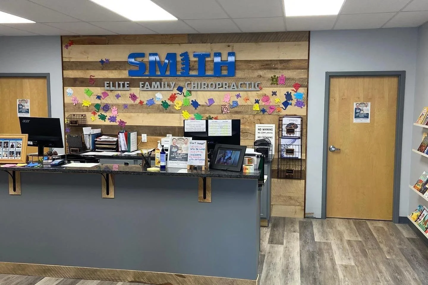Smith Elite office hallway with signage on wooden wall in Liberty MO