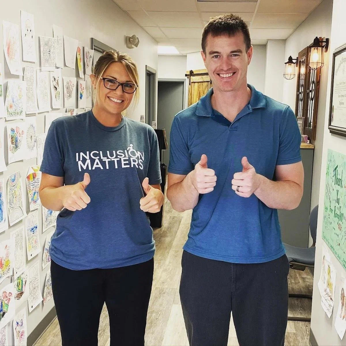 Dr and woman patient in inclusion matters shirts giving thumbs up for concussion support