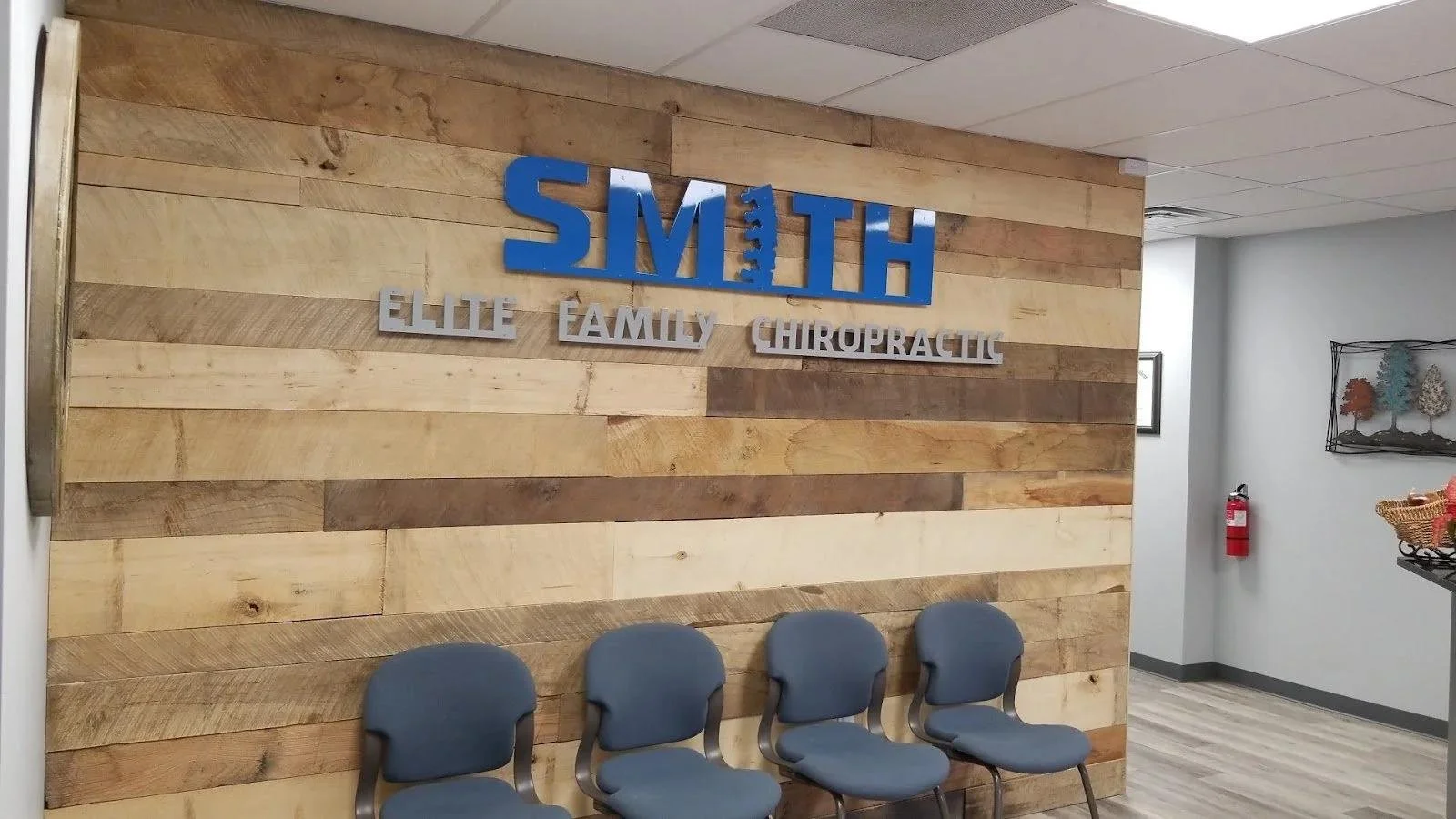 Smith Elite signage on wooden wall showing directions from Gladstone to Liberty MO