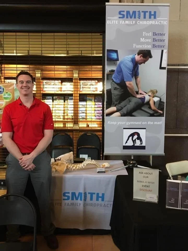 Dr at Smith Elite front desk during athletic performance chiropractic visit in Liberty MO. Smith Elite Family Chiropractic, 527 N State Rte 291 Suite B, Liberty, MO 64068.