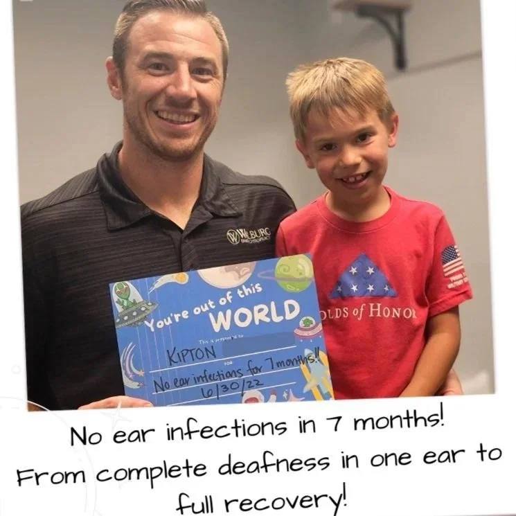 Father and son with ear infection recovery chalkboard testimonial